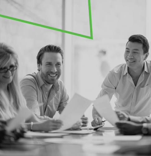 A small group of advisors talk casually in a large office space.