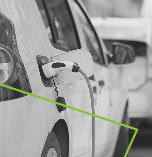 An electric car is plugged into a charging station.