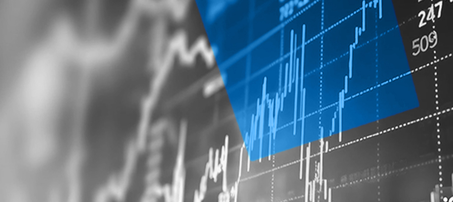 Computer screen showing an investment chart combined with mountains covered in evergreen trees.