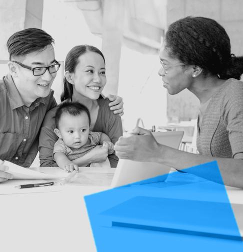 An advisor shows a young family an image on her tablet screen. 