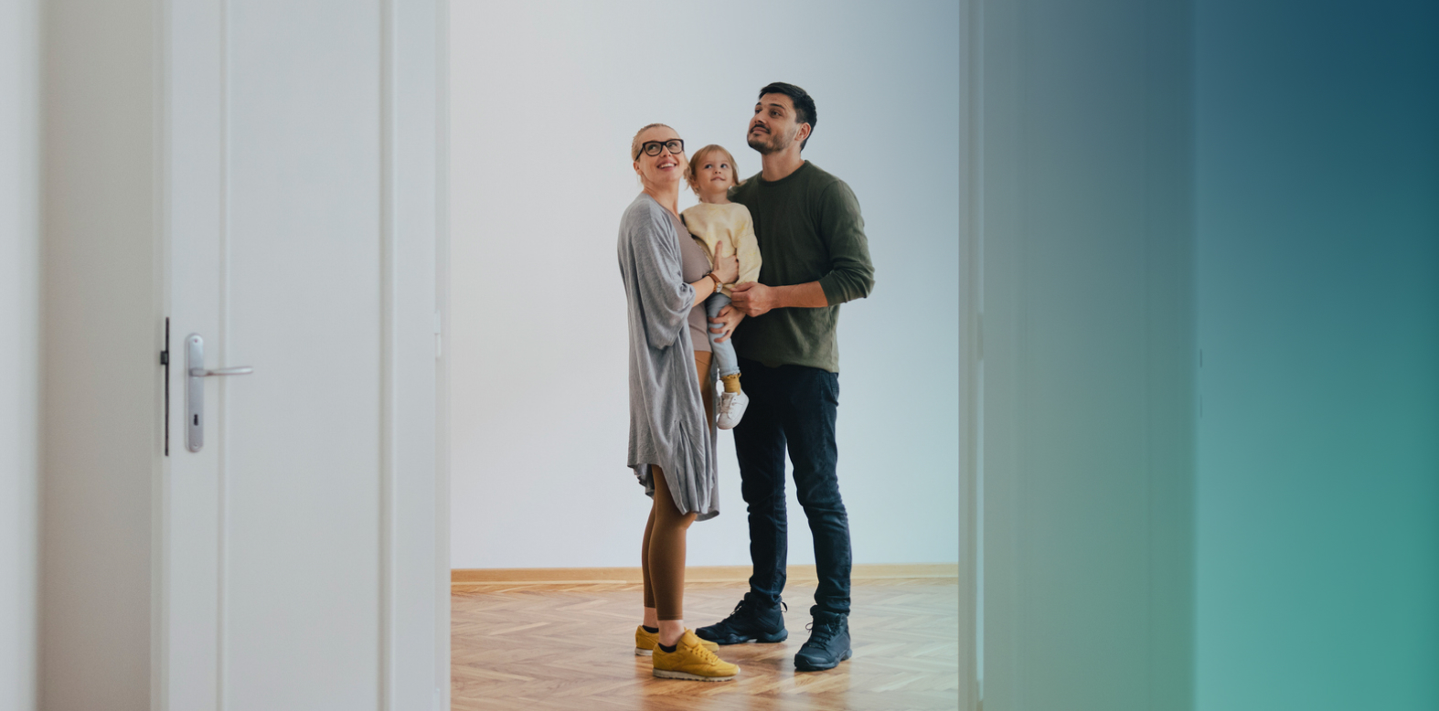 Young family in a room smiling